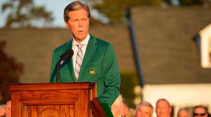 Fred Ridley speaks at the 2022 green jacket ceremony for winner Scottie Scheffler.